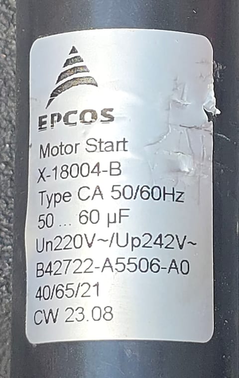 Capacitor label showing 50–60 microfarads and 220 VAC