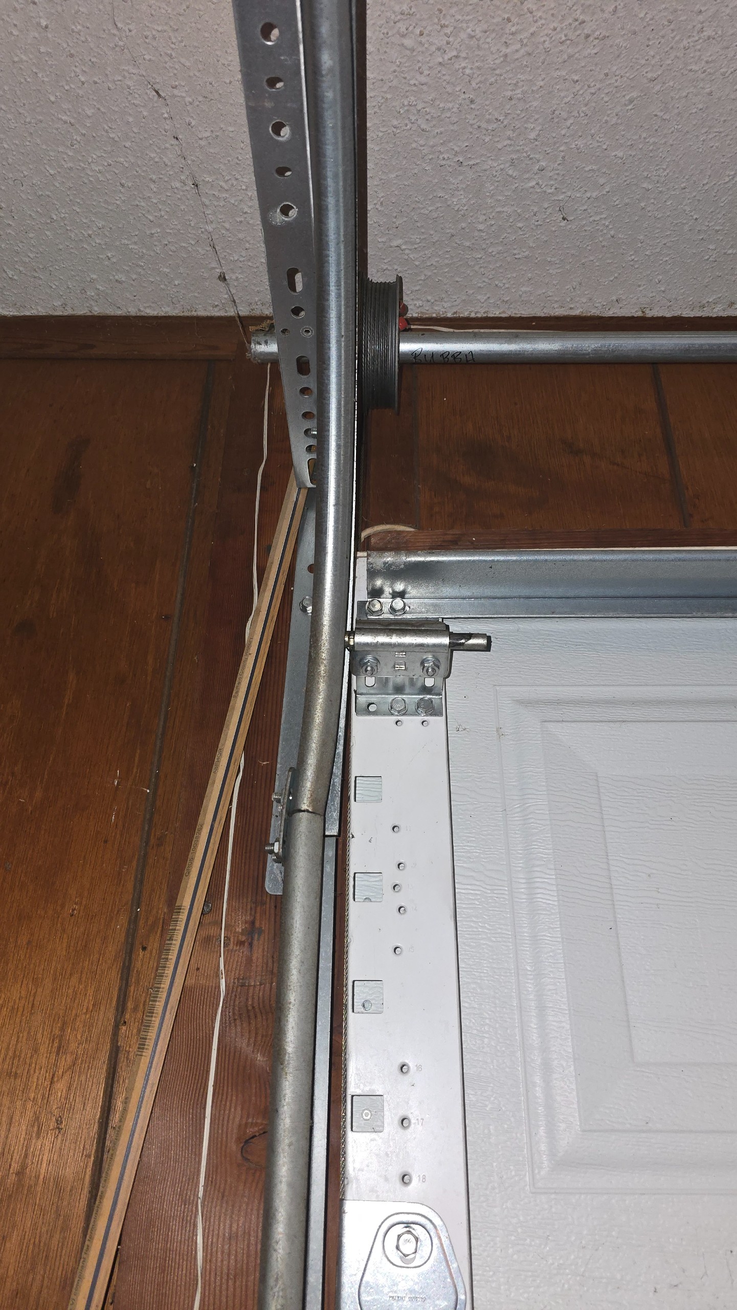 Garage door track and flag bracket identified as needing adjustment in Longview, TX